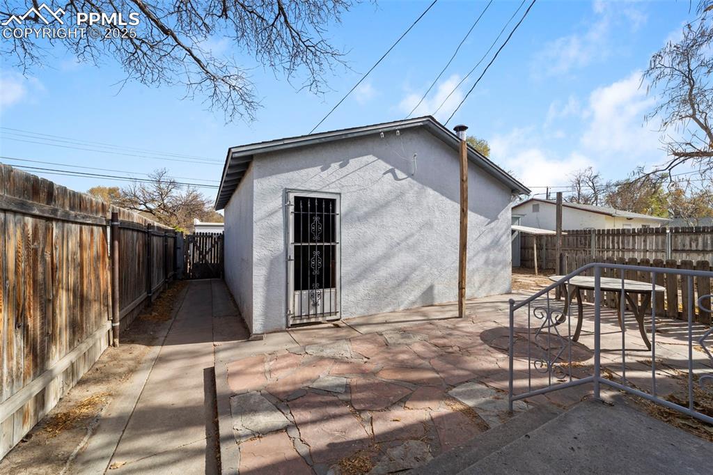 View of outbuilding featuring a fenced backyard