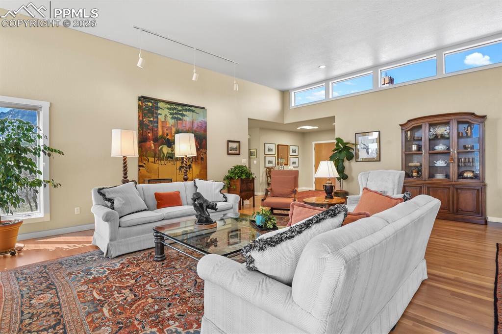 Living Room looking towards the front entry. Hardwood floors.  Lots of windows. 