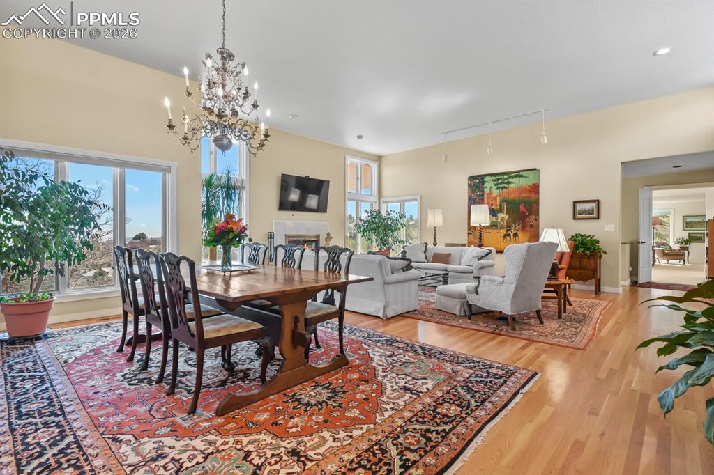 Dining Area showing all the windows, chandelier and hardwood floors.  