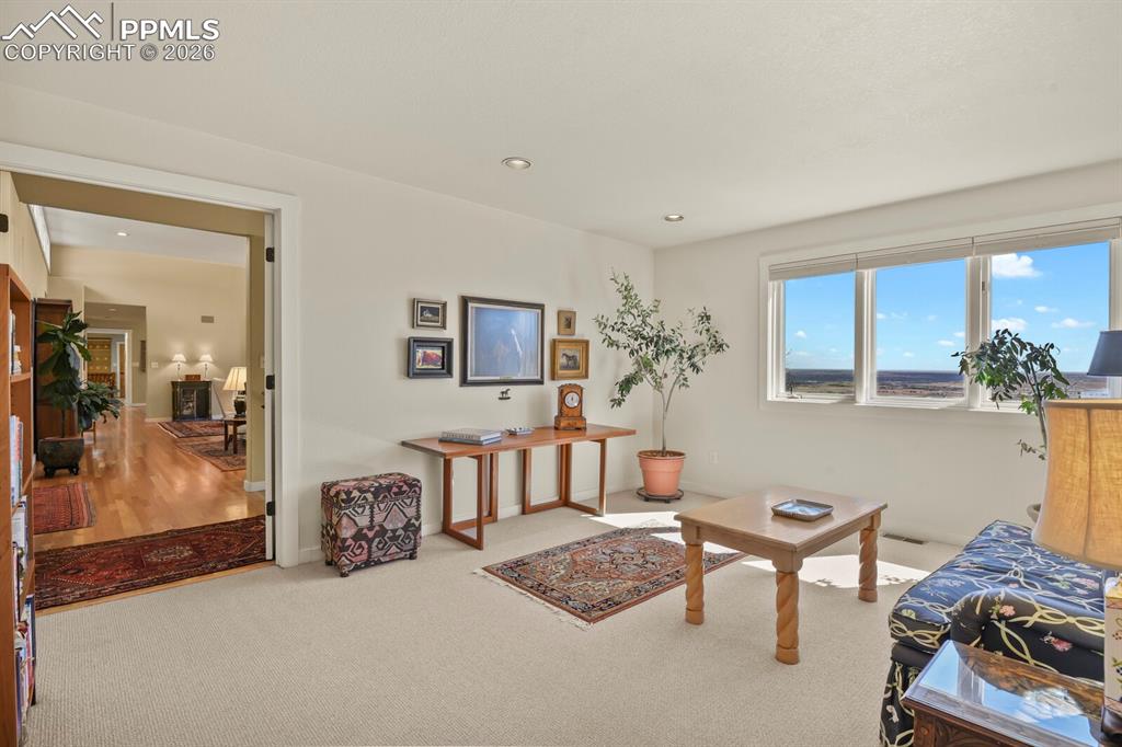Another view of the sitting room that is part of the Primary Suite.  Double Doors can close off the rest of the house if needed.