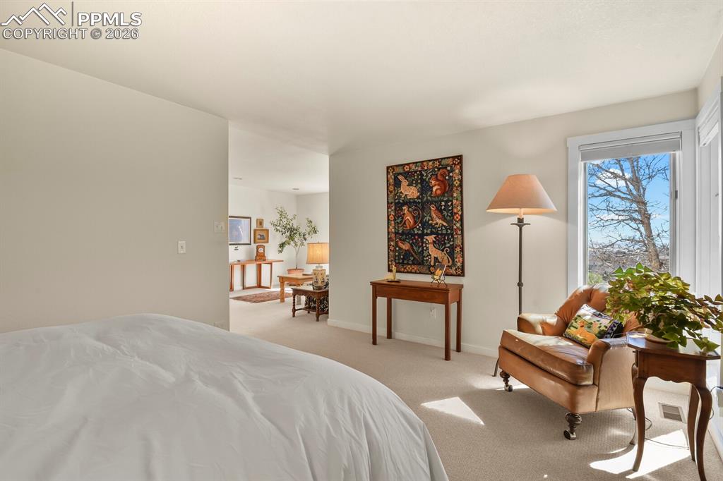 A view from the primary bedroom looking into the sitting room.