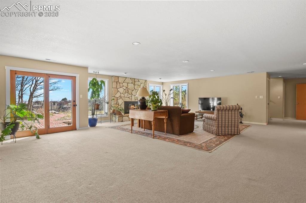 Another view of the 2nd Family Room, french doors, and light color carpet, canned lighting. 
