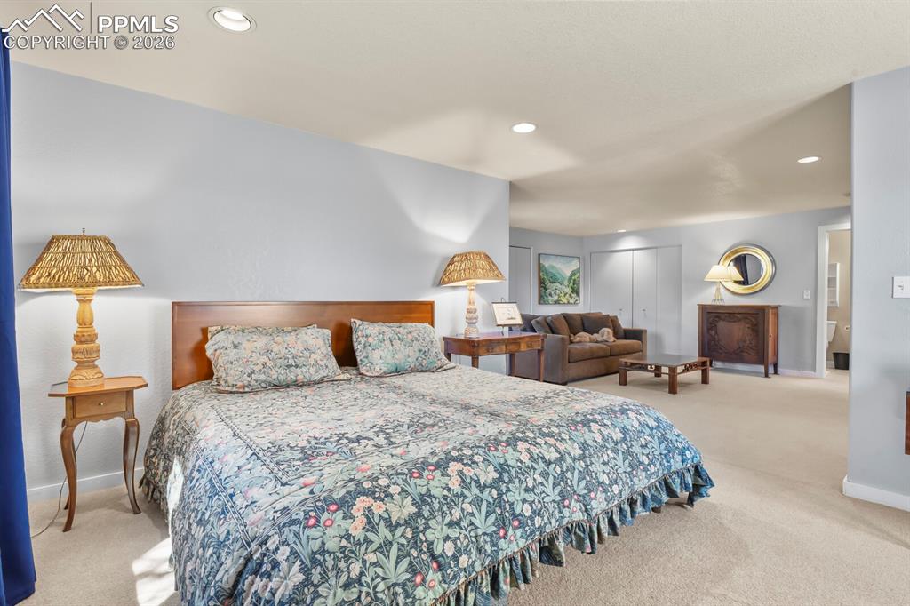 Another view of the secondary bedroom suite looking into the sitting area and door into the ensuite bathroom.