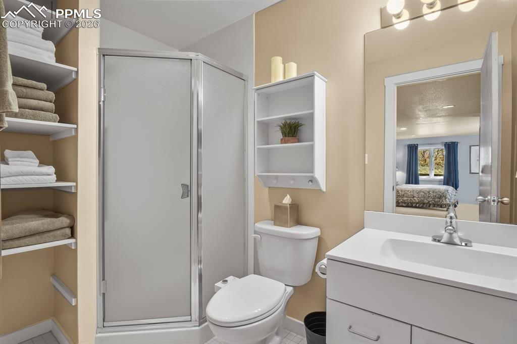 Ensuite bathroom to the secondary bedroom suite.  With shower and single vanity.