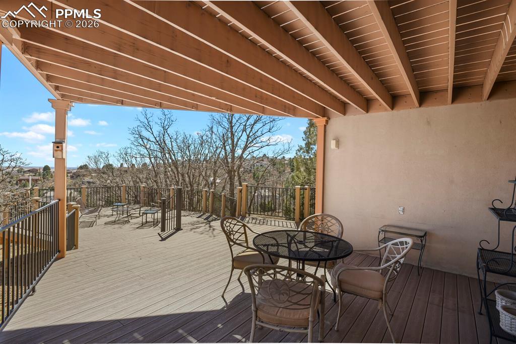 Covered area and the full deck looking towards the wrought iron railings and then out East.  Covered area providing a shaded spot to sit on those extra hot sunny days.