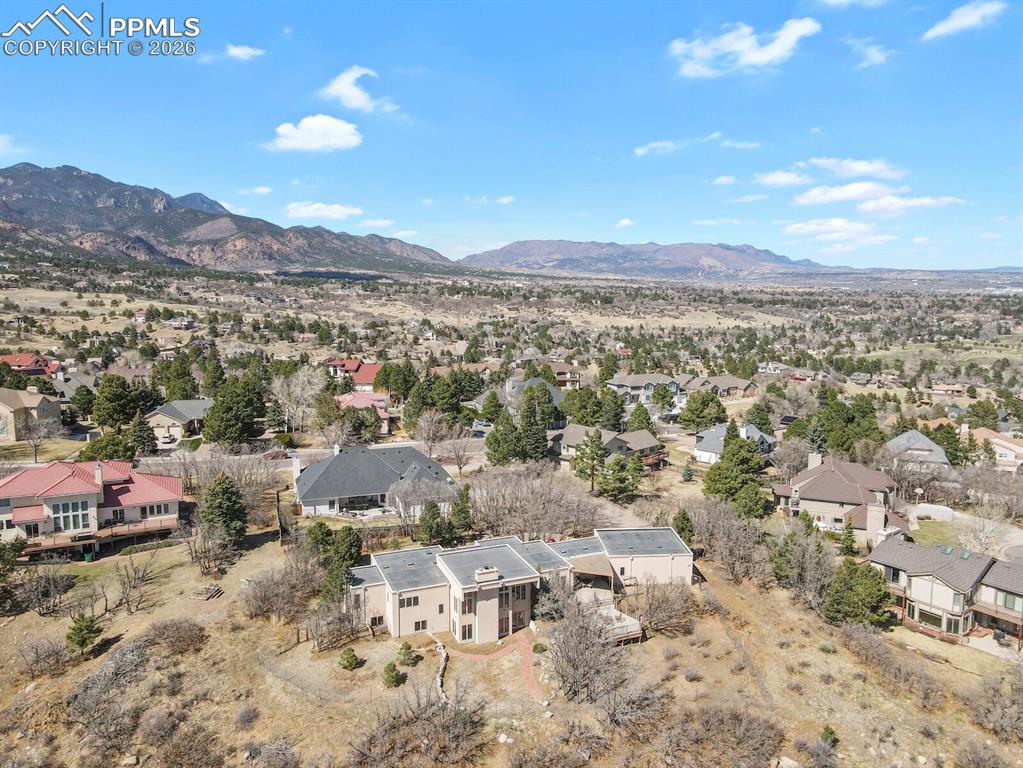 Aerial perspective of suburban area with a mountain backdrop