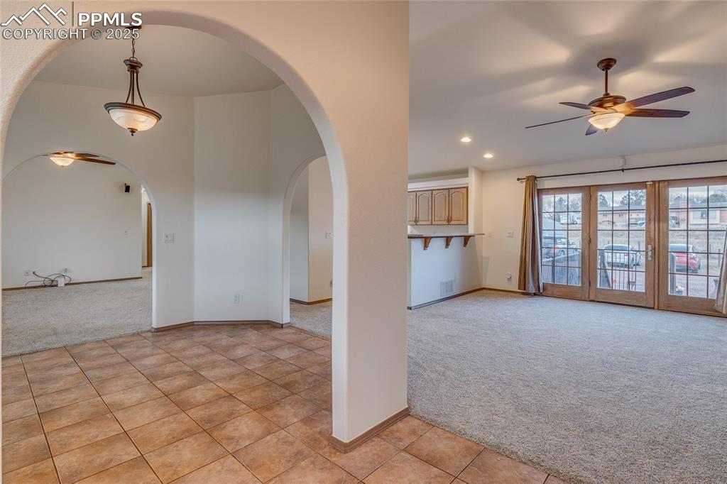 From entry - living room to the left and family room walk out to patio to the right