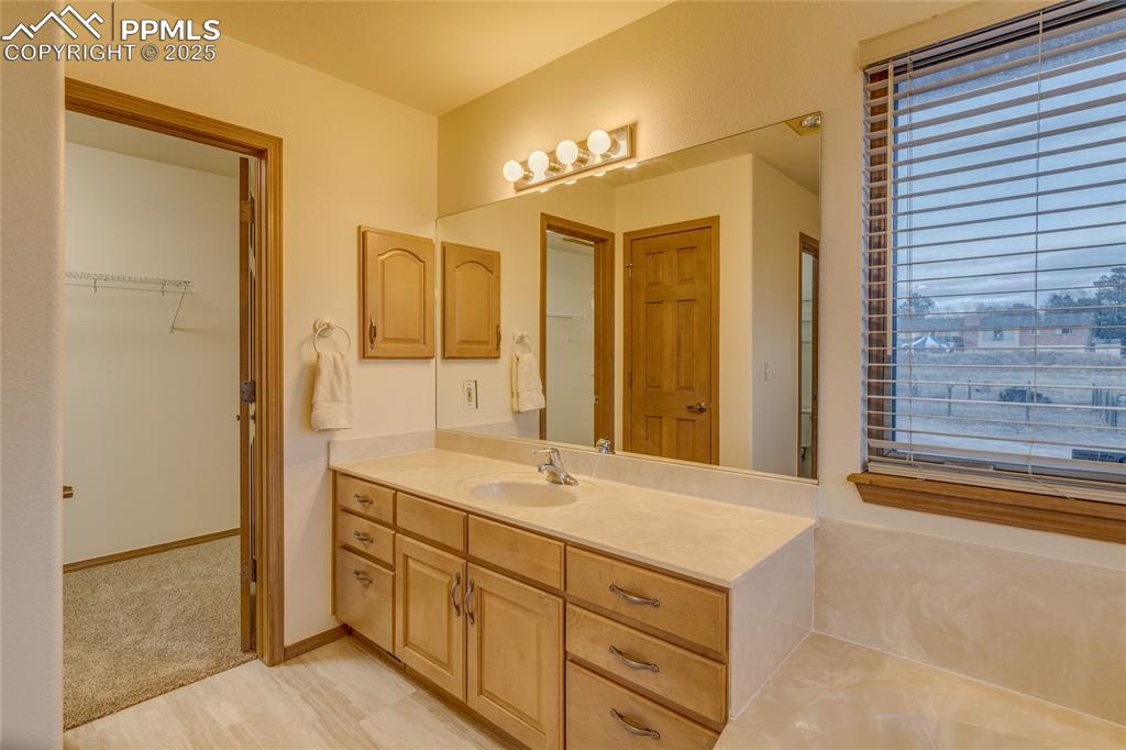 Primary bathroom with large walk in closet