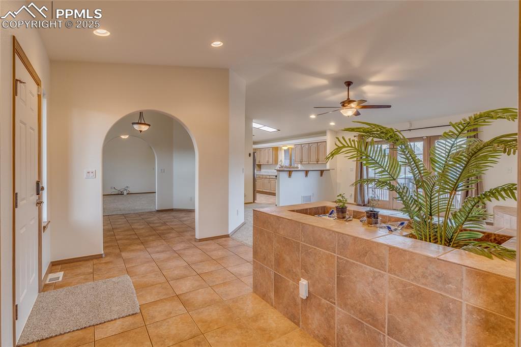 From double door entry to primary bedroom looking toward dining room - kitchen and family room to the right