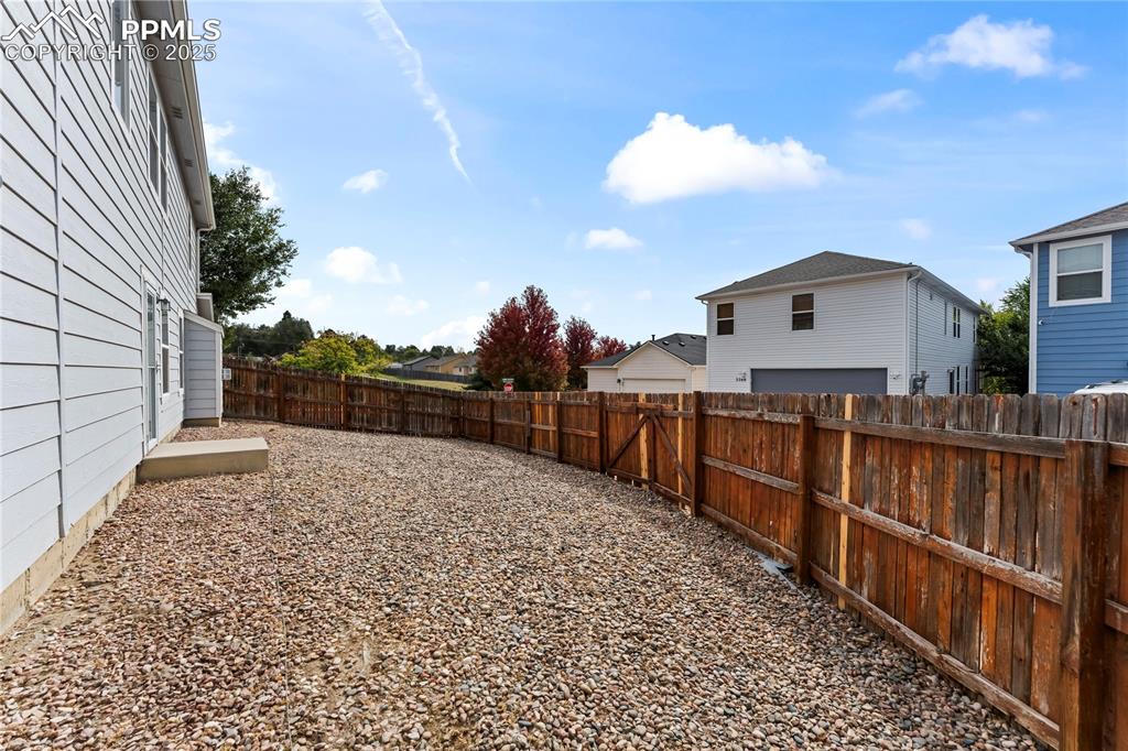 View of fenced backyard