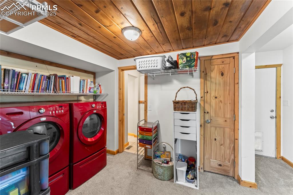 Laundry area with door to side/back yard and closet