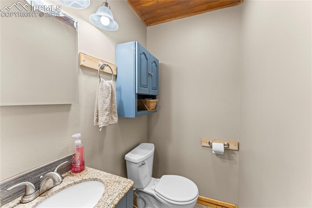 Bathroom with vanity and wooden ceiling
