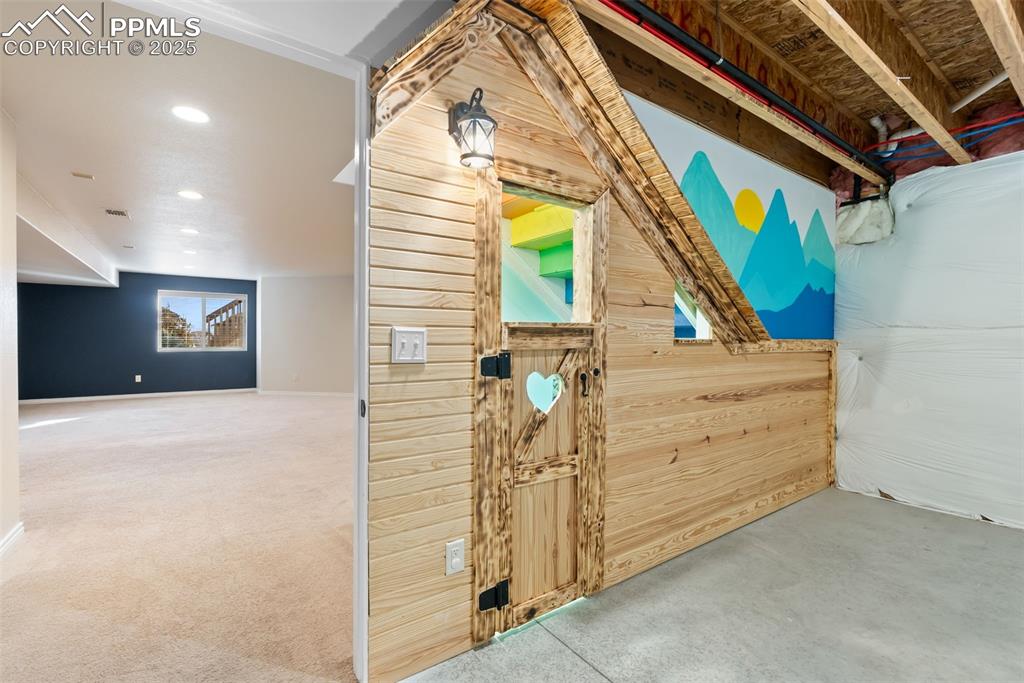 Kids play room under the stairs.