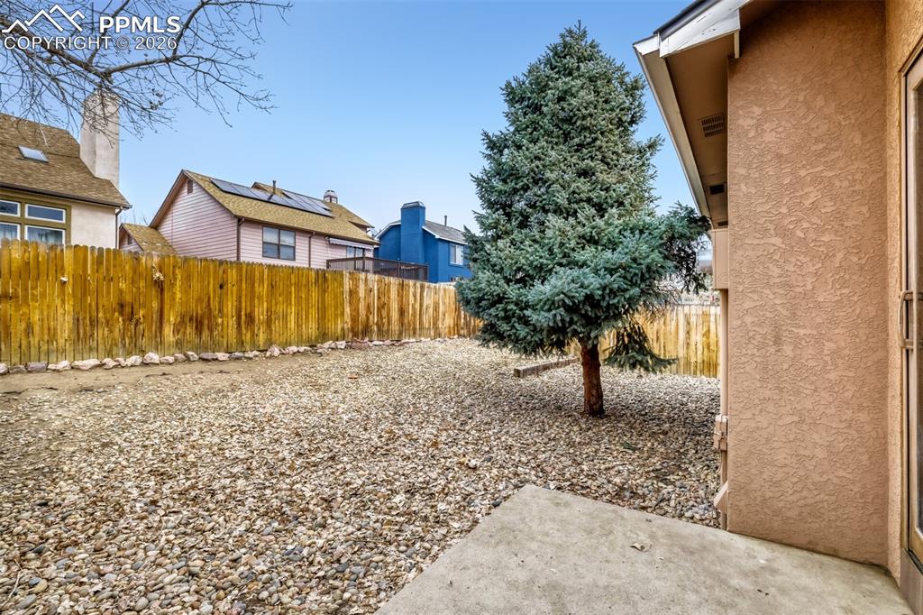 Fenced backyard featuring a patio area
