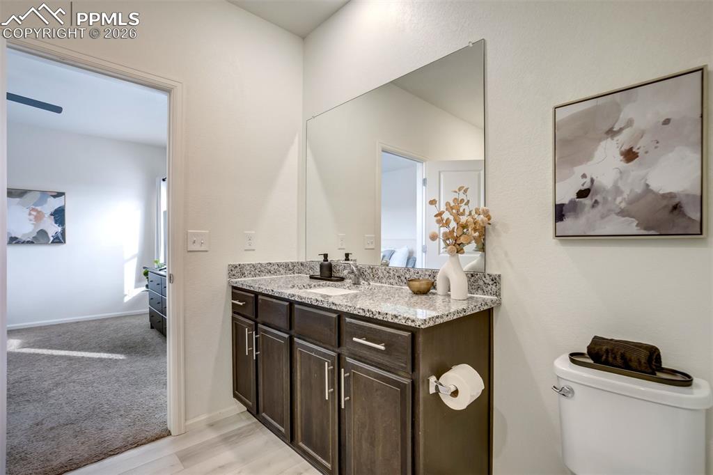 Granite in the bathroom with LVP flooring. 