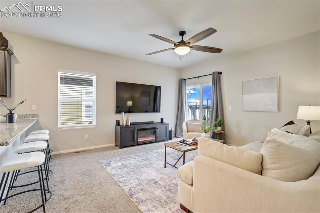 Efficiently sized living room right off the kitchen— because the best conversations happen when people are actually close enough to hear each other