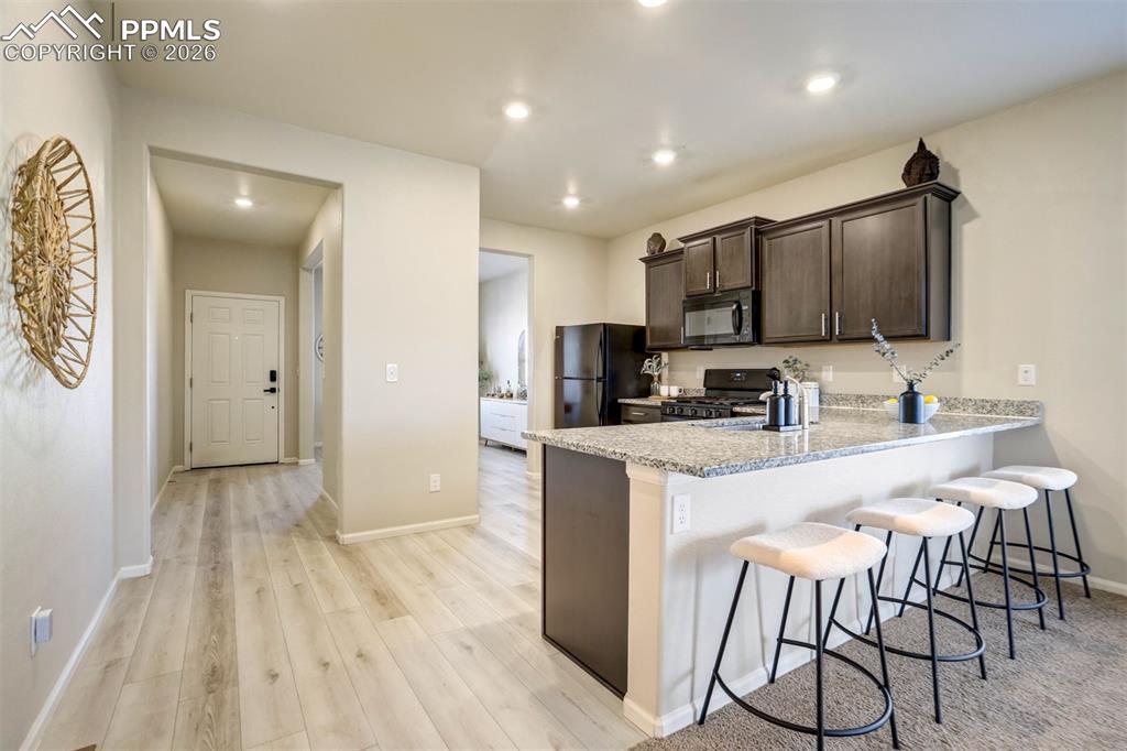 Welcoming entry with tall ceilings.