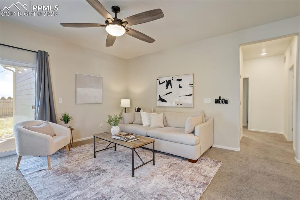 Hallway off the living room leads to all 3 bedrooms. 