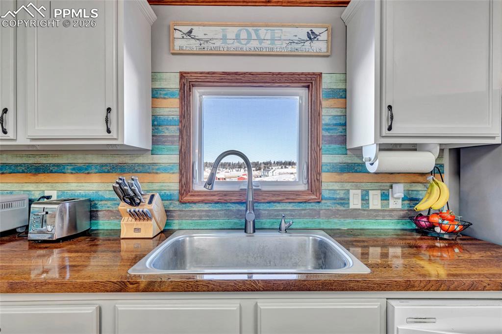 Kitchen with white cabinetry