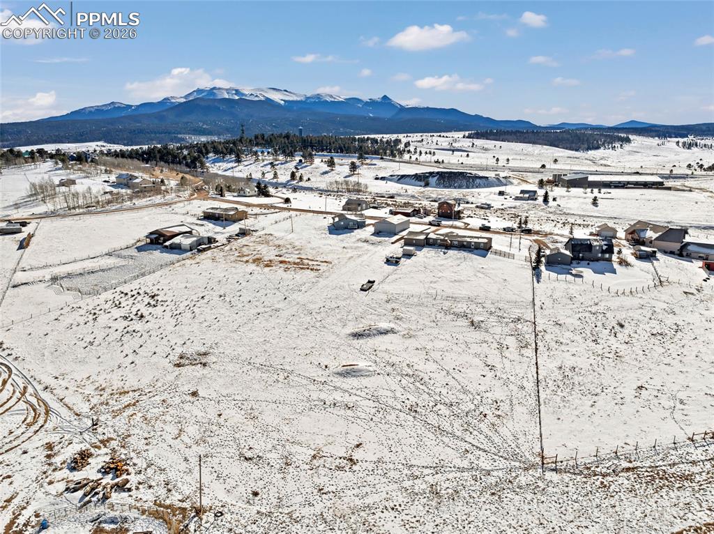 Snowy aerial view with a mountain view