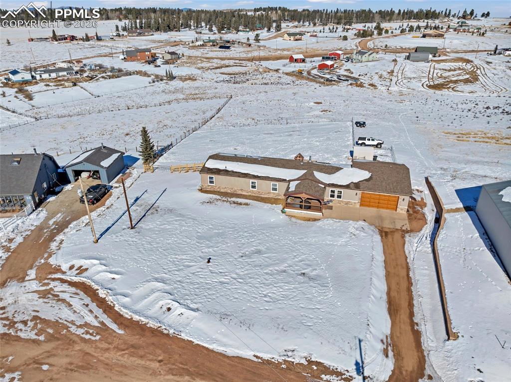 Snowy aerial view with a residential view