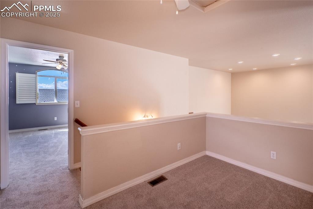 Spare room with carpet floors, recessed lighting, and a ceiling fan