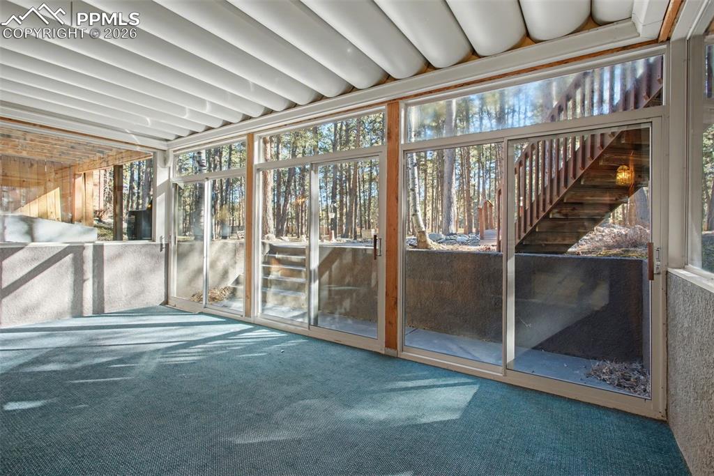 Unfurnished sunroom with plenty of natural light