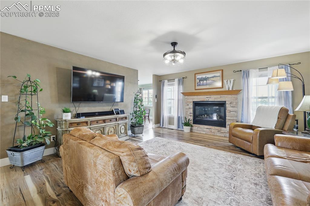 Main level living room with cozy gas fireplace.