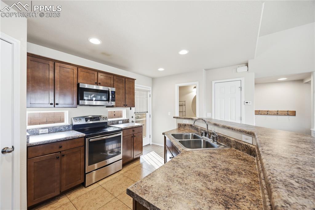 Powder Bathroom and walk out to an enclosed patio from the Kitchen.