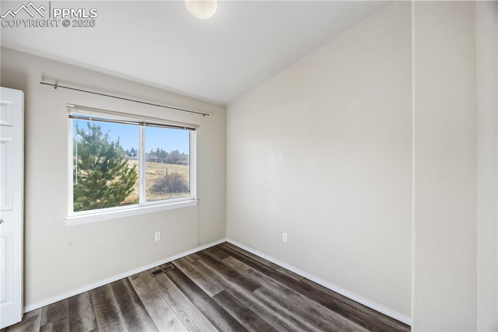 Bedroom #1 offers a vaulted ceiling, LVP flooring, and vaulted ceiling.