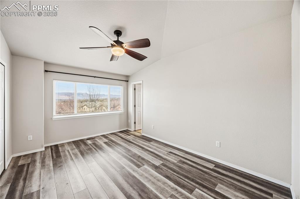 The Primary Bedroom is a private retreat with LVP flooring, a lighted ceiling fan, deep closet, and adjacent Bathroom