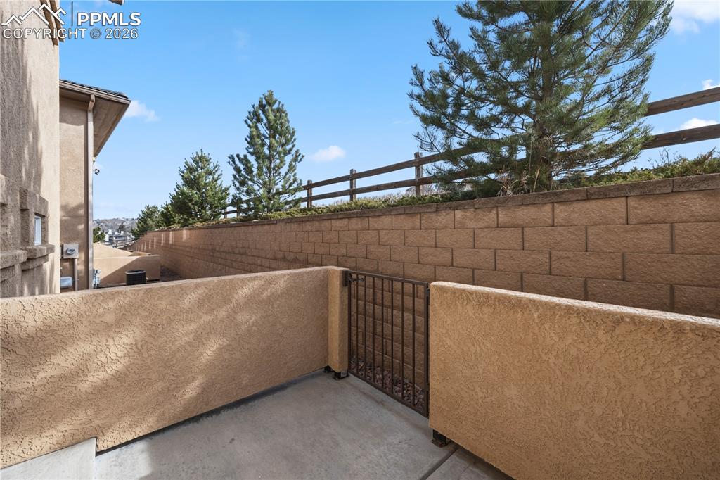 Enclosed back patio for outdoor dining and relaxation.