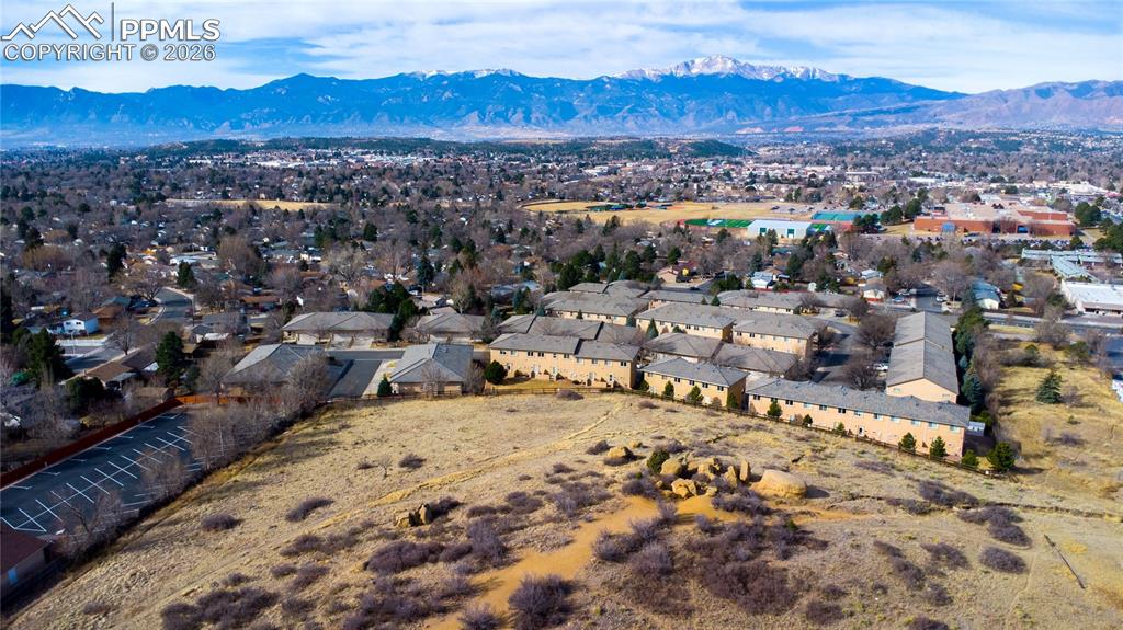 Aerial view of community, open space, and gorgeous Pikes Peak and mountain views.