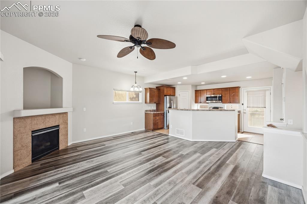 The Living Room has a gas fireplace with tile surround to cozy up on on chilly nights.