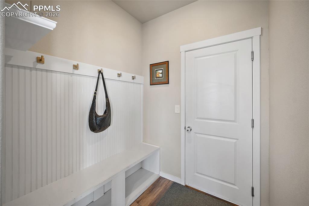Mud room with custom storage built-ins. Garage entry
