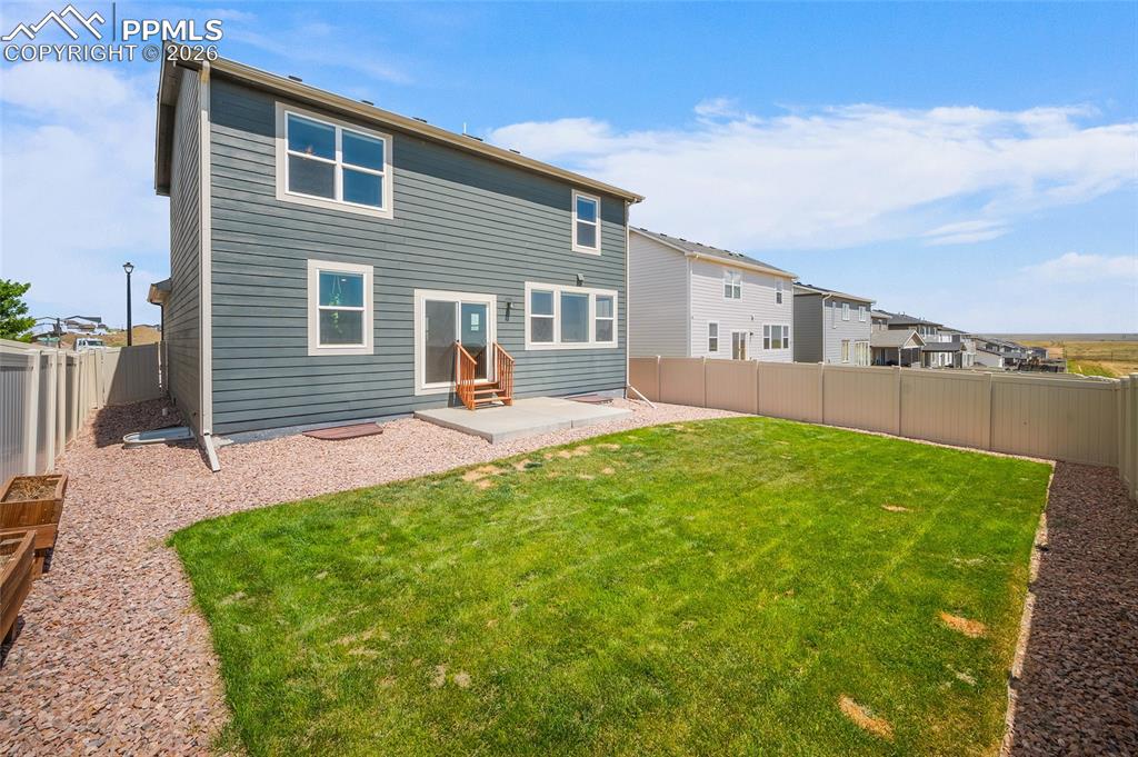 Professionally landscaped backyard complete with sprinkler system