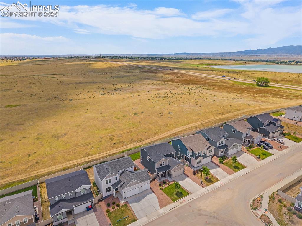 Aerial perspective of suburban area with a mountain backdrop