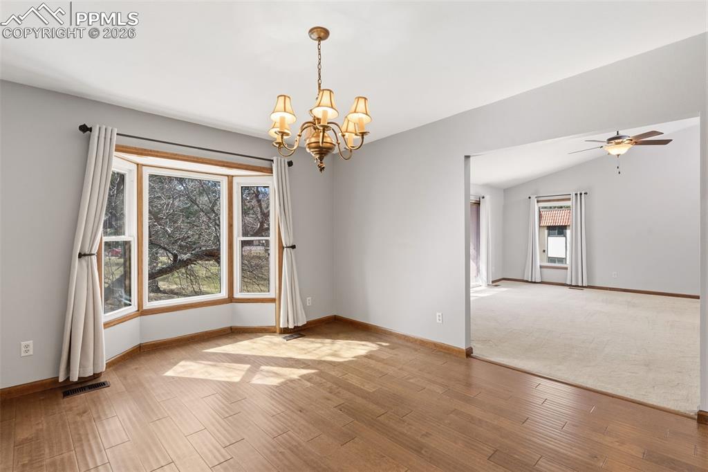 Hardwood Dining Room with community and mountain views
