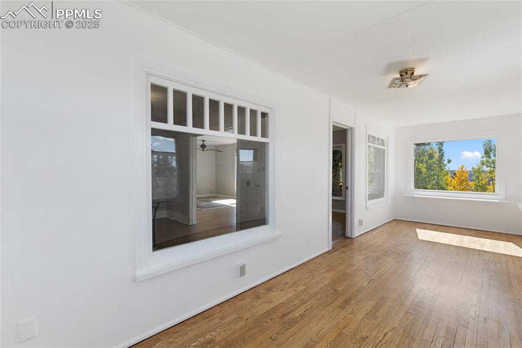 Spare room with wood finished floors and baseboards