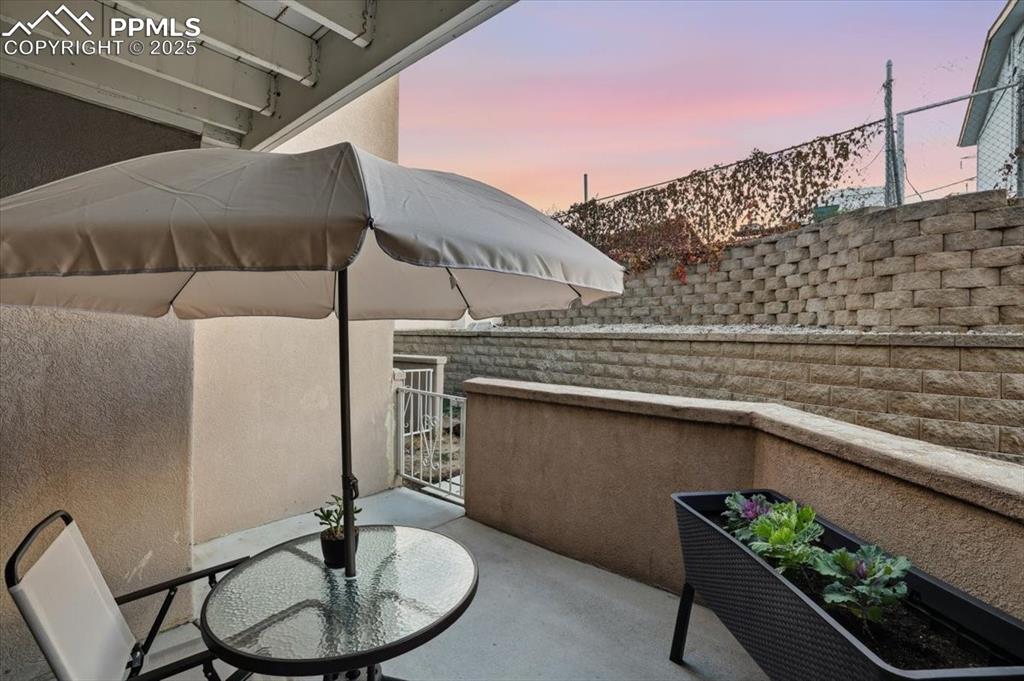 Patio terrace at dusk with a balcony