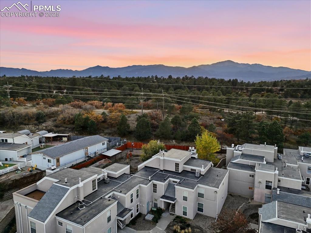 Aerial view at dusk of a mountain view and a residential view