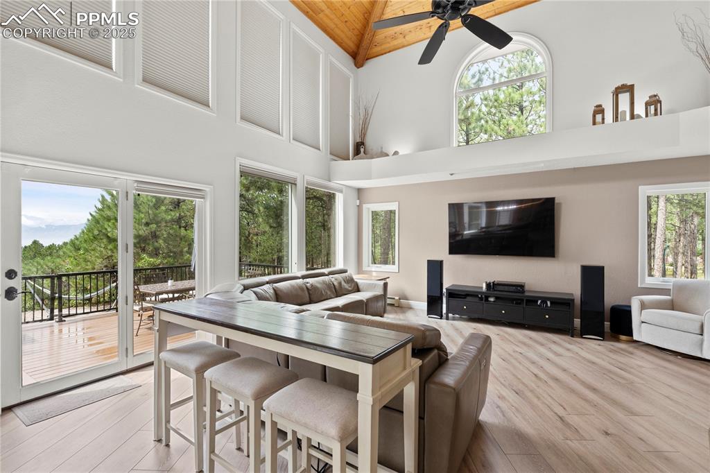 The living room walks out to the TREX deck overlooking 3.5 acres