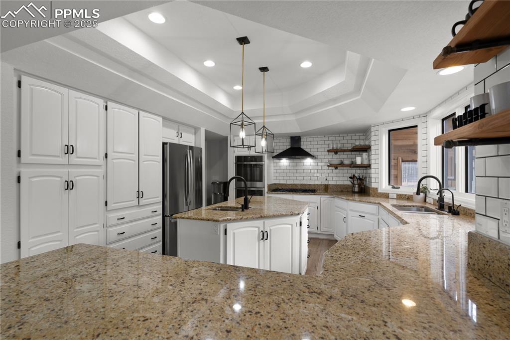 The kitchen is large and flows with the rest of the house to create an inviting space.