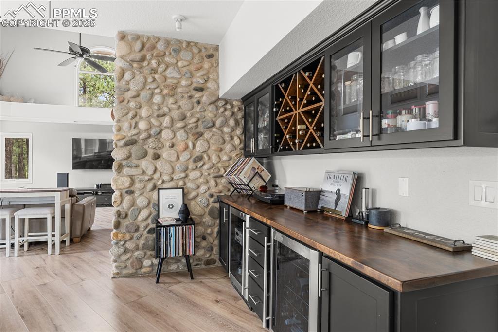 The bar area offers additional storage space with a separate beverage fridge!