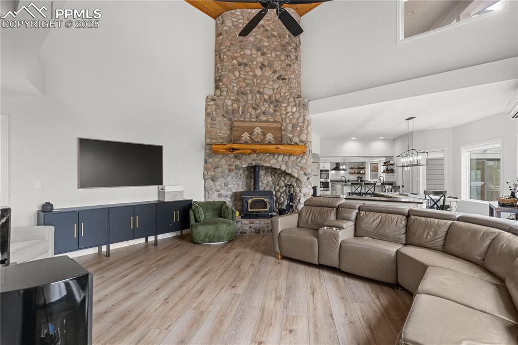 With luxury vinyl flooring and soaring ceilings, this living room feels inviting and airy 