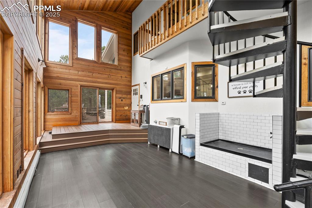 The sunroom, off of the living room offeres a dog wash area, additional storage and access to the upstairs master.