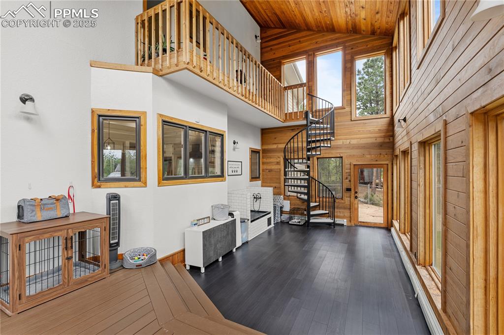 The sunroom, aptly named for the bountiful views and natural light allows you to enjoy the outdoors while staying warm in the winter and cool in the summer.