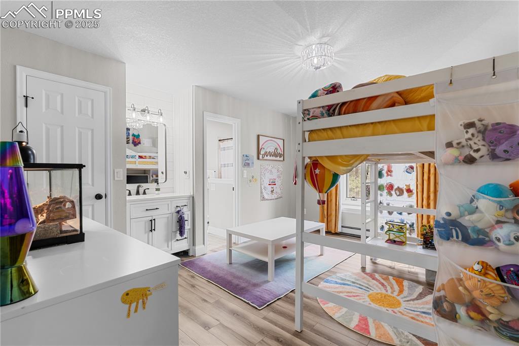 Bedroom with private sink and bathroom access