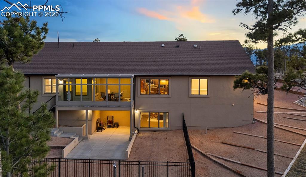 Enclosed upper patio area to enjoy the outdoors year round as well as a fenced area
