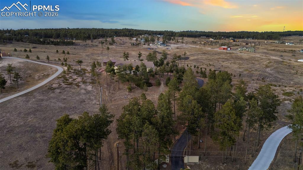 Property has an entrance gate, paved drive and is full of wildlife.